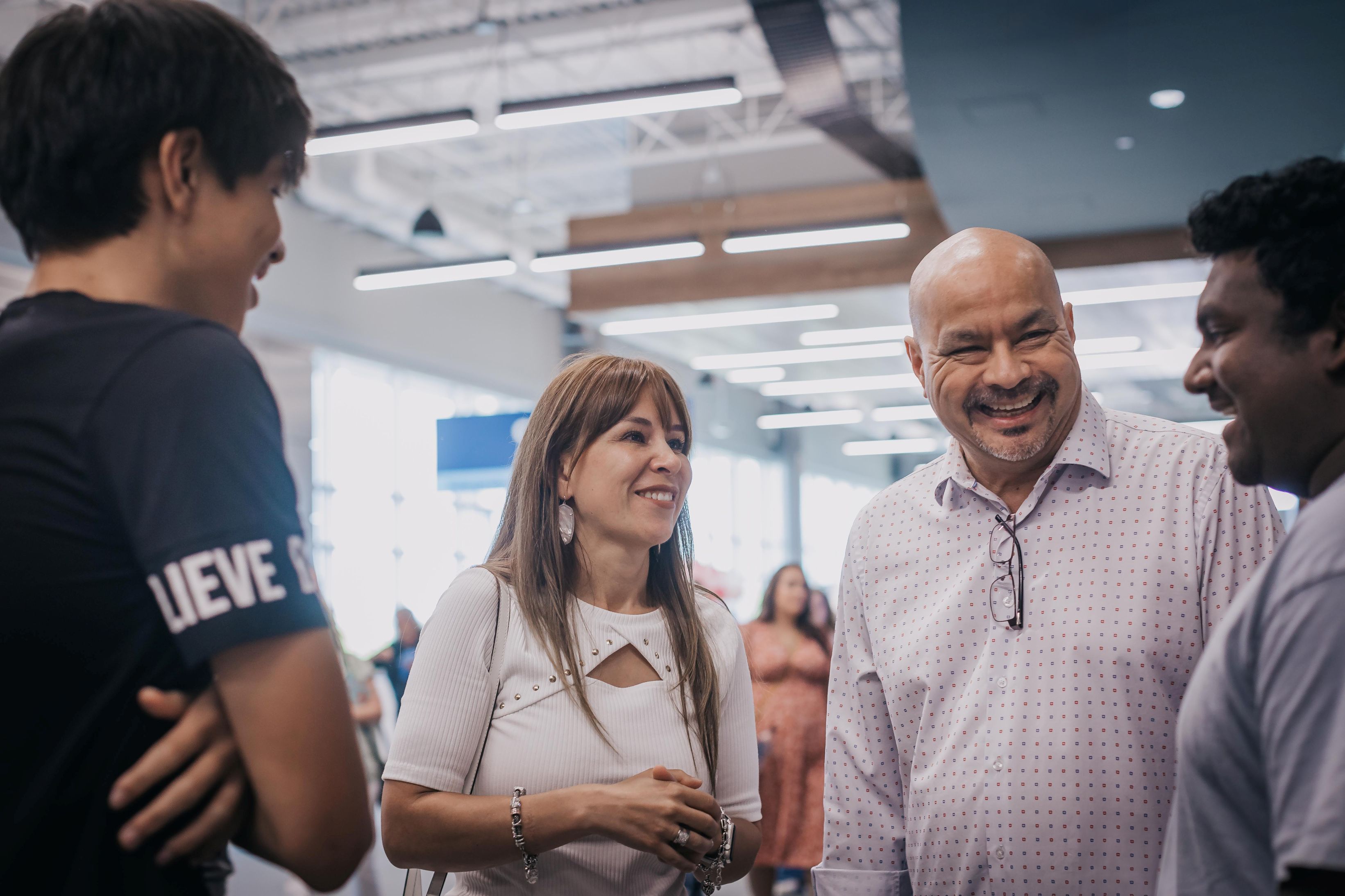 Group of people smiling and talking