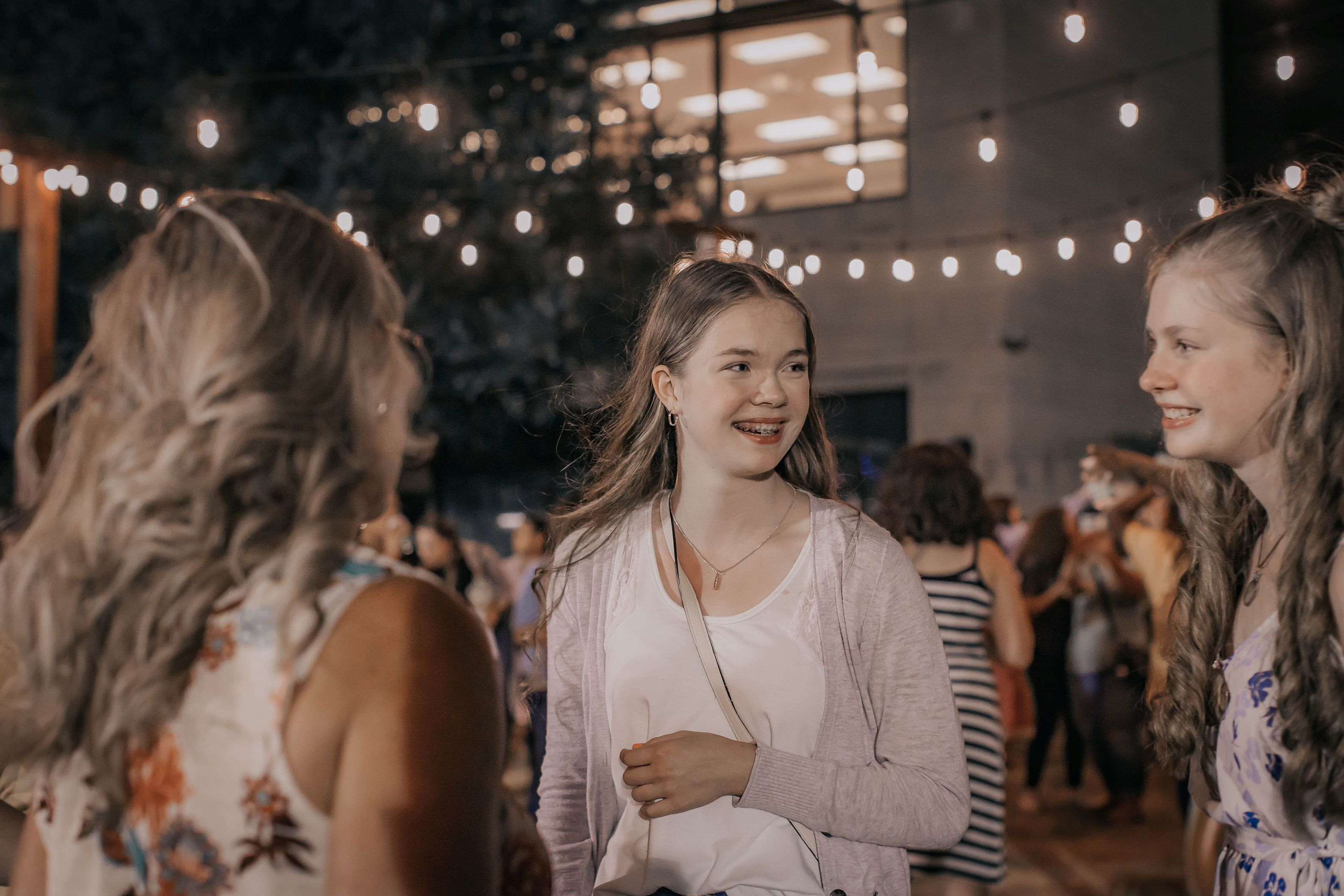 3 Women smiling and talking